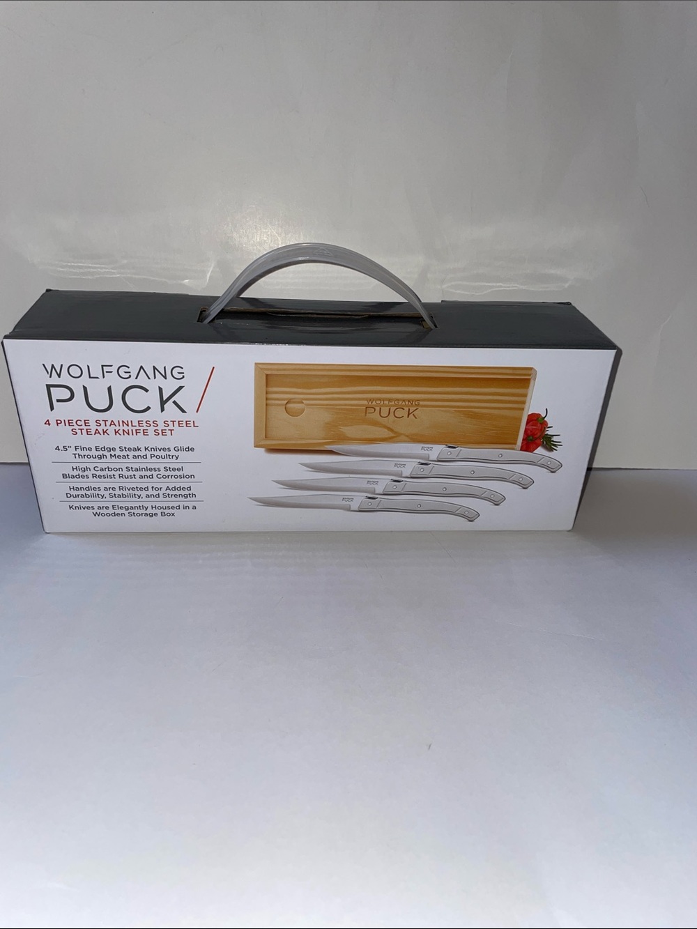 NIB Wolfgang Puck 4-Piece Stainless Steel Steak Knife Set.
